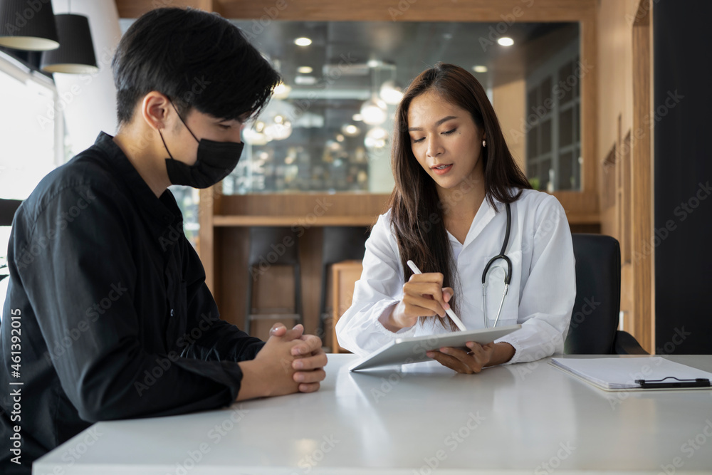 Young man patient having consultation with doctor in hospital. Young man patient having consultation with doctor in hospital.