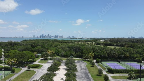 Key Biscayne, Miami, Florida USA. Aerial View, Tennis and Golf Club Fields With Downtown in Skyline on Sunny Day, Drone Shot photo