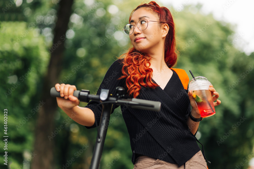 Asian Woman , Using Electric Scooter In The Park, New Gadget For Fast City Movement Without Traffic Jams