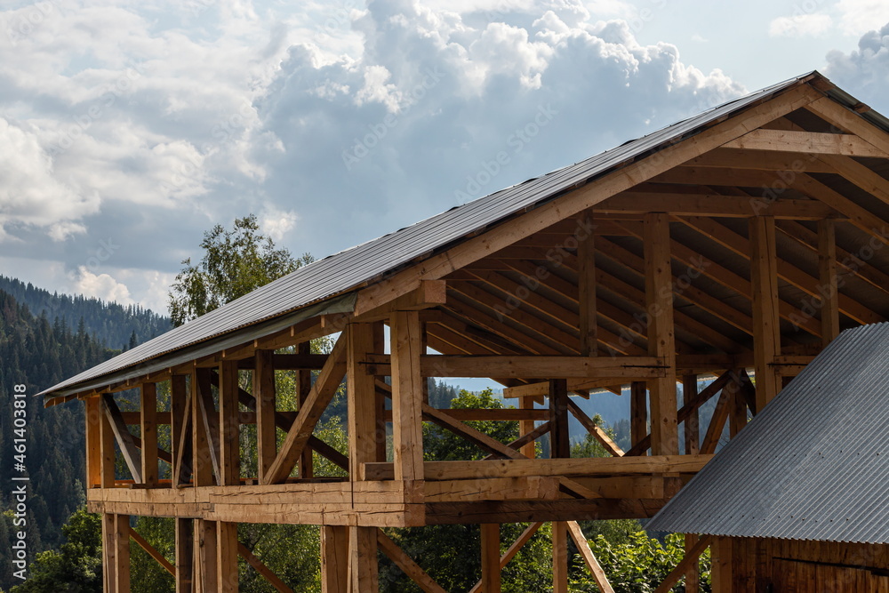 Fototapeta premium roof and wooden beams part of house construction traditional european