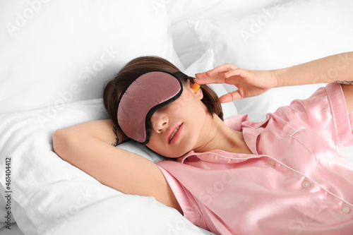 Young woman with ear plug i...