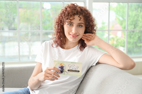 Young woman with gift certi...