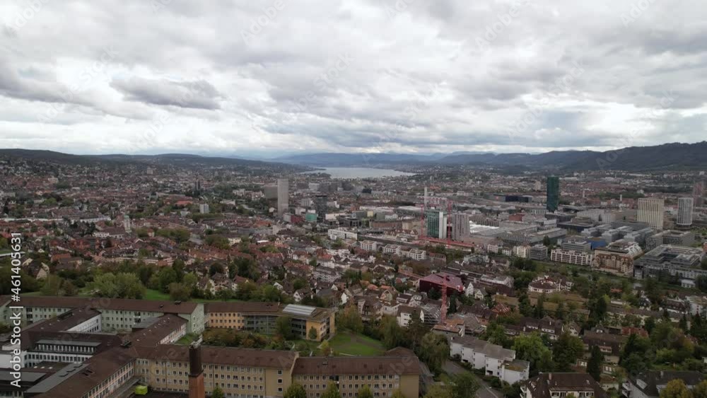 Forward rising aerial over the cityscape of Zurich in Switzerland, cloudy day. Forward rising aerial over the cityscape of Zurich in Switzerland, cloudy day.
