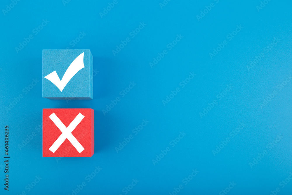 True and false symbol on blue and red cubes against bright blue background with copy space True and false symbol on blue and red cubes against bright blue background with copy space