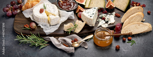 Obraz na plátně Cheese assortment on dark background.