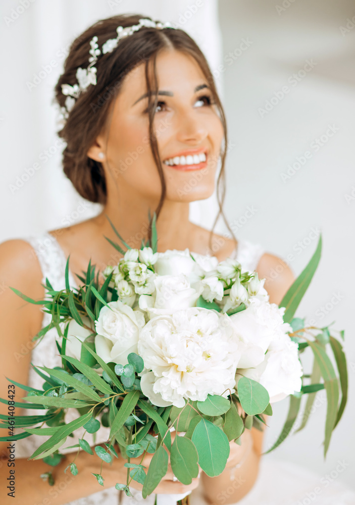 Portrait of a beautiful bride with a bouquet of flowers Portrait of a beautiful bride with a bouquet of flowers