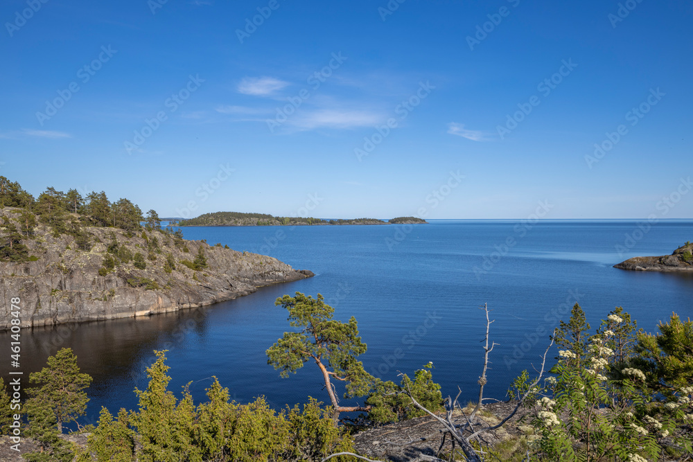Obraz premium Northern nature. Karelian skerries. lake Ladoga. Channel of lake Ladoga with stony banks.