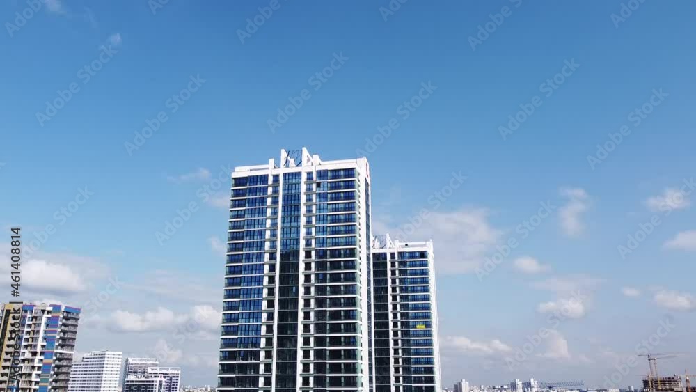 A smooth upward flight overlooking a beautiful new business center with apartments. Modern architecture. 25 September 2021, Minsk, Belarus A smooth upward flight overlooking a beautiful new business center with apartments. Modern architecture. 25 September 2021, Minsk, Belarus