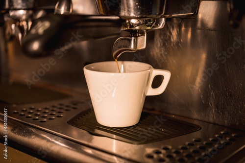 Coffee machine putting a decaf in a white cup