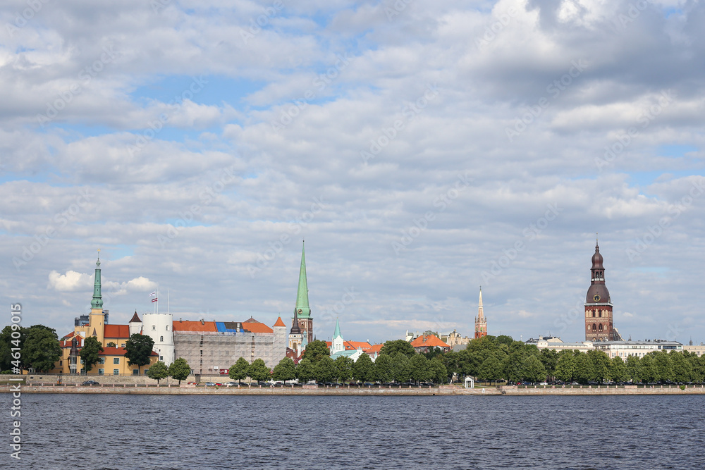 Fototapeta premium Cityscape view of old Riga architecture buildings and churches near river Daugava.