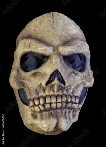 Yellowed Skull Mask Isolated Against Black Background