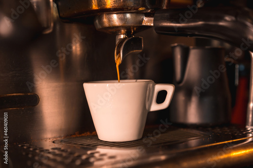 A white cup of decaf coffee ready for a customer to pick up