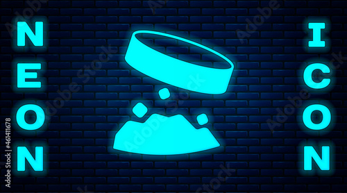 Glowing neon Giant magnet holding iron dust icon isolated on brick wall background. Vector