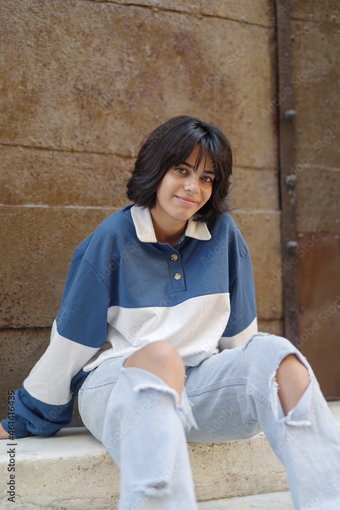 Close up of teenage girl sitting on steps Close up of teenage girl sitting on steps