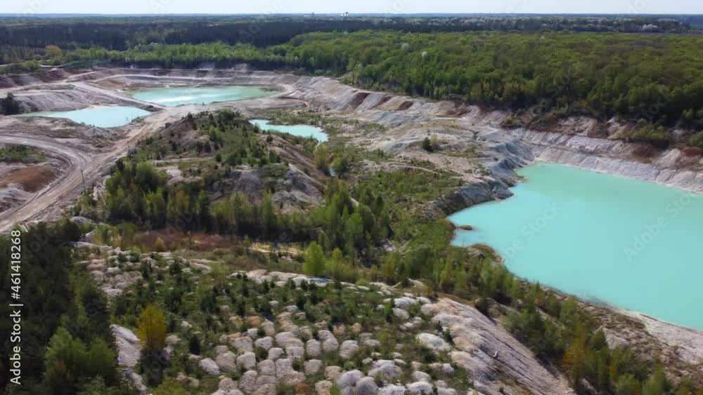 Small turquoise quarry lakes in abandoned kaolin pit, aerial view Small turquoise quarry lakes in abandoned kaolin pit, aerial view