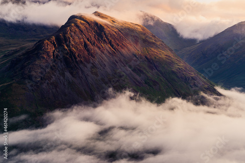Cloud inversion of Yewbarrow Mountain in the Lake District National Park, England.  This was taken at sunrise from Ill Gill Head mountain on the opposite side of Wastwater in the Wasdale Valley. photo