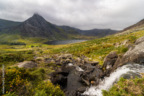 Tryfan Mountain Landscape with Ogwen Water and a waterfall leading down to Ogwen Water and the very distinctive and attractive Tryfan Mountain.
