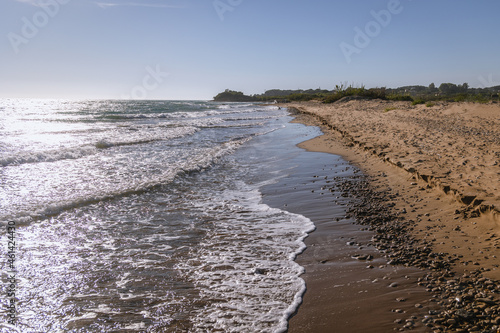 Waves on Halikounas Beach on a land strip between Ionian Sea and Korission Lake, Corfu Island, Greece