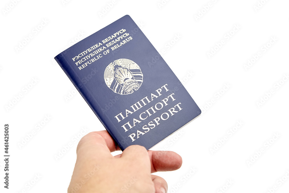Passport of Republic of Belarus with blue cover in hand isolated on white Passport of Republic of Belarus with blue cover in hand isolated on white