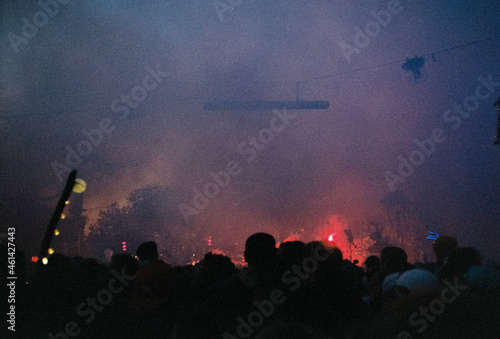 crowd of people dancing at concert