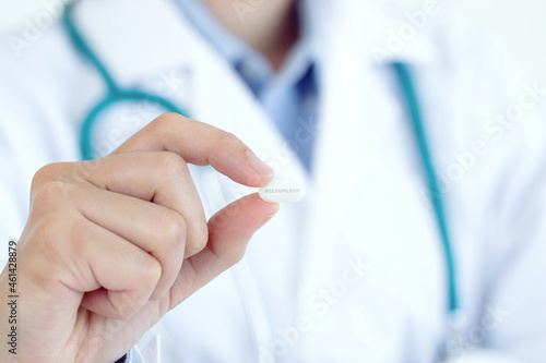 Wallpaper Mural Close up female doctor with holding medicine Molnupiravir .Coronavirus covid-19 antiviral concept Torontodigital.ca