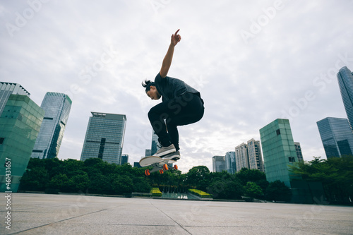 Skateboarder skateboarding outdoors in city photo