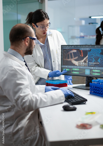 Obraz na plátně Scientist team discussing coronavirus discovery analyzing biomedical expertise developing virus vaccine during medical experiment