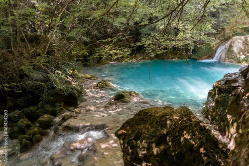 Beautiful blue hidden lake in the middle of the woods