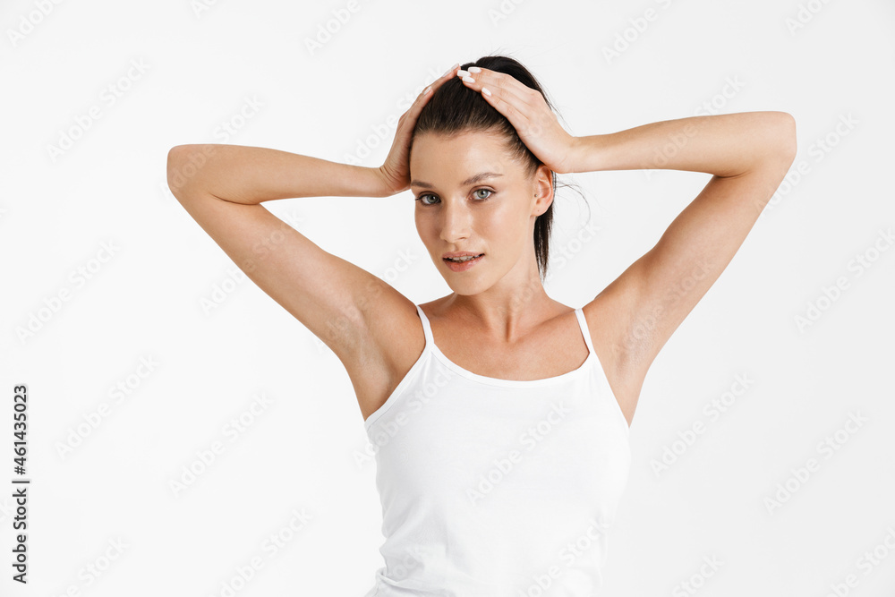 European woman wearing underwear holding her head and looking at camera European woman wearing underwear holding her head and looking at camera