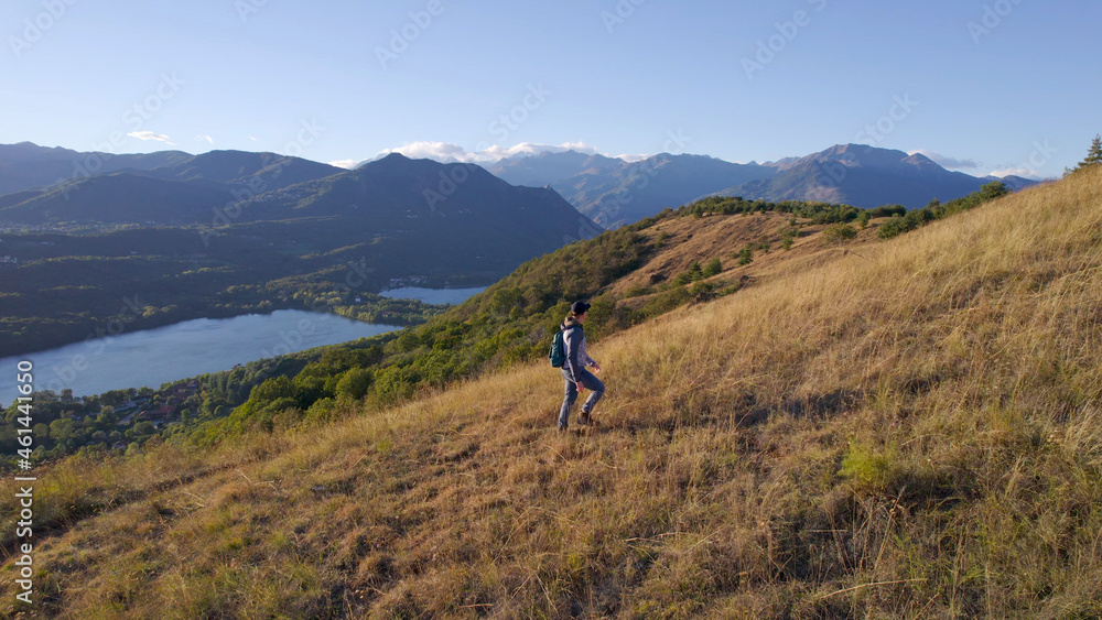 Young Man Hiking in the Mountains at Sunset in Italy, Aerial