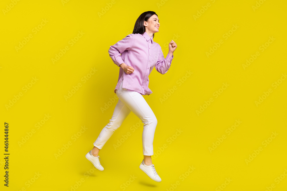 Full size profile photo of nice brown hairdo young lady run wear pink shirt pants isolated on yellow color background