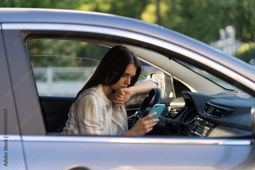 Frustrated girl cry reading sms message in smartphone while driving car. Upset young female break up with boyfriend in traffic jam getting bad news in mobile phone. Unhappy sad woman driver in tears Frustrated girl cry reading sms message in smartphone while driving car. Upset young female break up with boyfriend in traffic jam getting bad news in mobile phone. Unhappy sad woman driver in tears