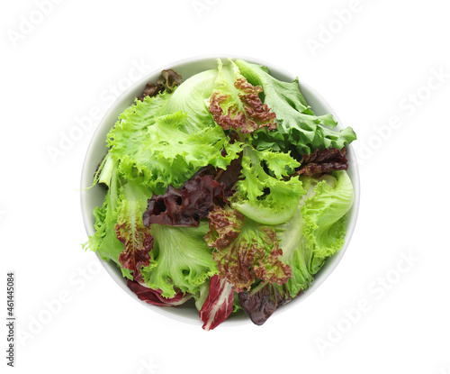 Bowl with leaves of different lettuce on white background, top view photo