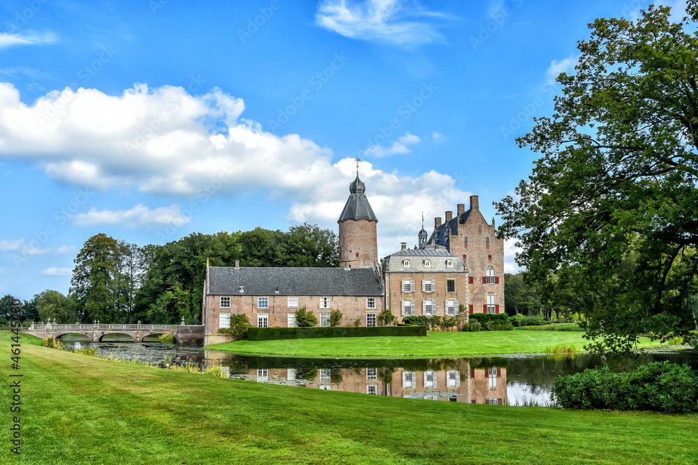 Castle in Vilsteren is situated on an island in a dead river arm of the Overijsselse Vecht. A stone arch bridge gives access to the castle. Netherlands, Holland, Europe