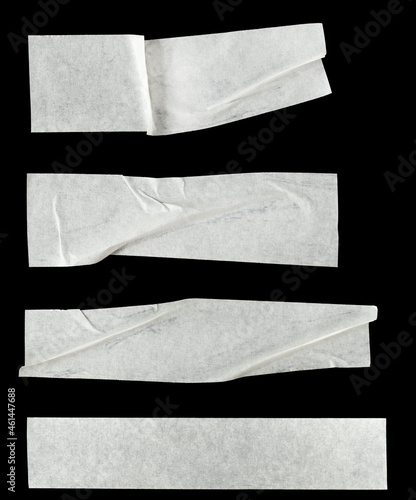 Collage white pieces of scotch tape isolated on a black background.  set stripes of masking tape. Insulating tape photo