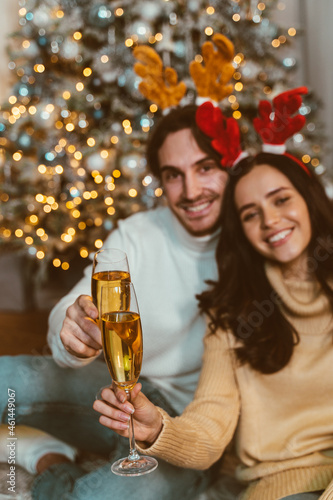 Cinematic image of a couple celebrating christmas at home.