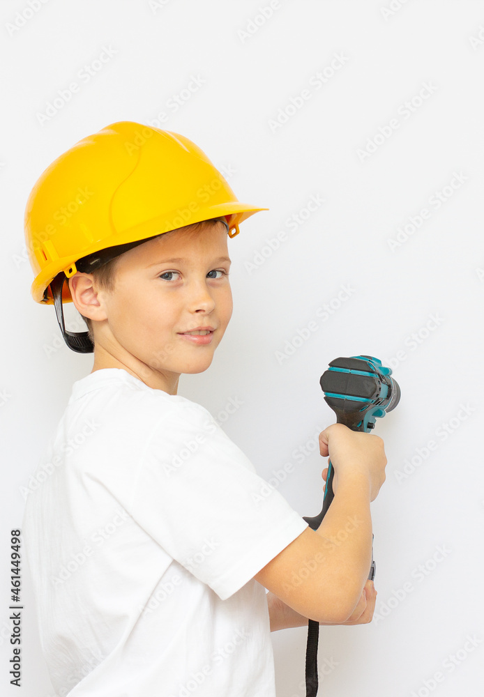 little boy in a helmet with screwdriver little boy in a helmet with screwdriver