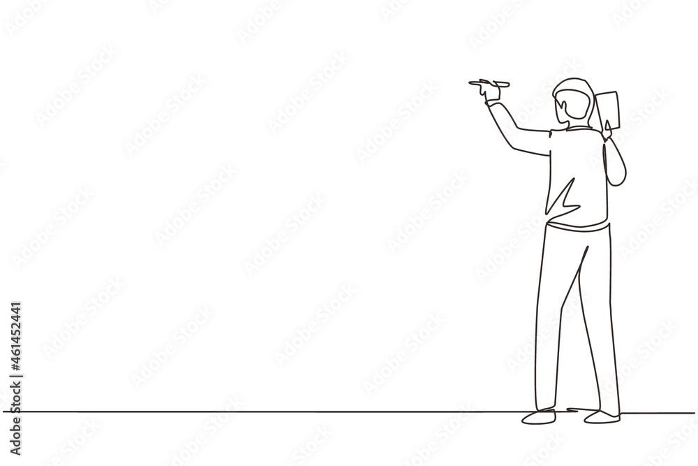 Single continuous line drawing business school professor teaching explaining and writing formula on chalkboard. Business man teacher standing at class. One line draw design graphic vector illustration