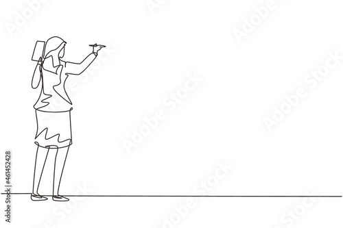 Single continuous line drawing business school professor teaching explaining and writing formula on chalkboard. Young business woman teacher standing at class. One line draw design vector illustration