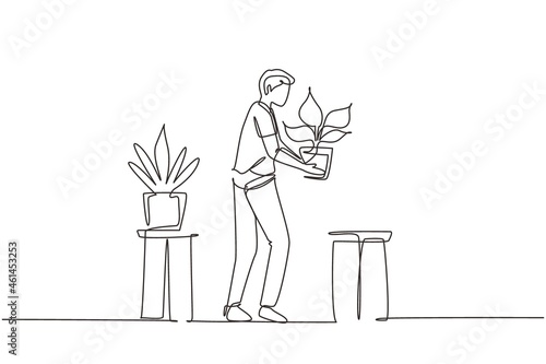 Single continuous line drawing male put green plants in greenhouse home garden. Man florist gardener working, growing flower houseplants in pots, botanical. One line draw design vector illustration