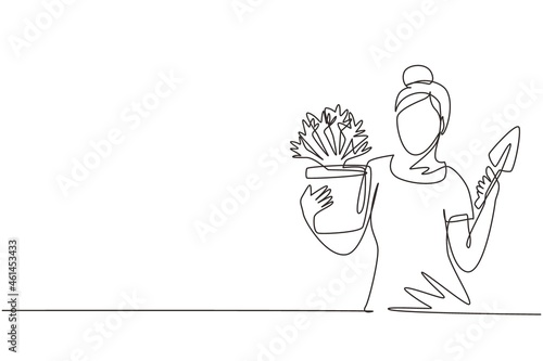 Single continuous line drawing young woman gardener. Beautiful lady farmer holding little shovel and plant in pot. Gardener takes care of home garden. One line draw graphic design vector illustration