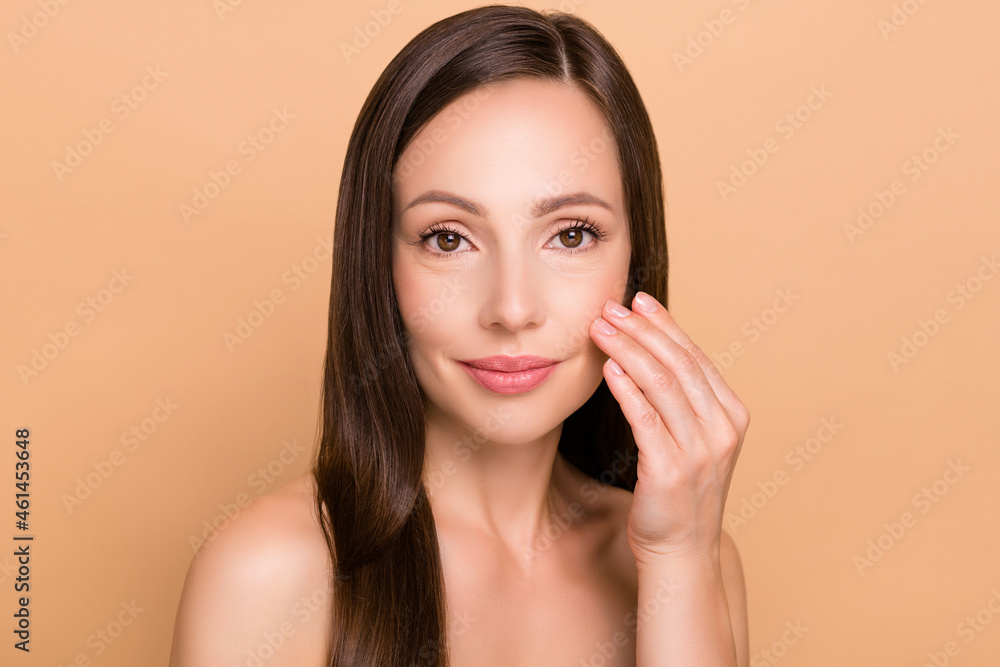 Photo of positive adorable young lady wear nothing nude smiling arm cheek isolated beige color background Photo of positive adorable young lady wear nothing nude smiling arm cheek isolated beige color background