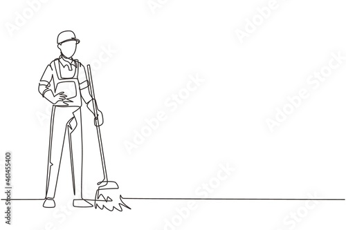 Continuous one line drawing smiling young male janitor standing in uniform, sweeping the floor with broom, professional cleaning, home and office service. Single line draw design vector illustration photo