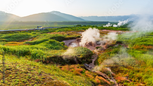 Steaming, sulfuric, active fumaroles near Pauzhetskaya Geothermal Power Plant, Kamchatka Peninsula, Russia photo