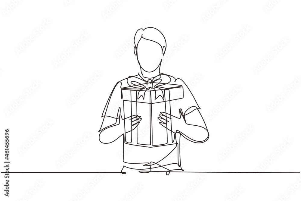 Single continuous line drawing man holding big ribbon bow wrapped gift box in his arms. Young male holding a gift. Guy with a gift box. Gift for the holiday. One line draw design vector illustration
