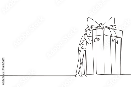 Continuous one line drawing guy hugging huge birthday gift. Young satisfied man standing near wrapped birthday gift box with bow. Present, gift, birthday. Single line draw design vector illustration