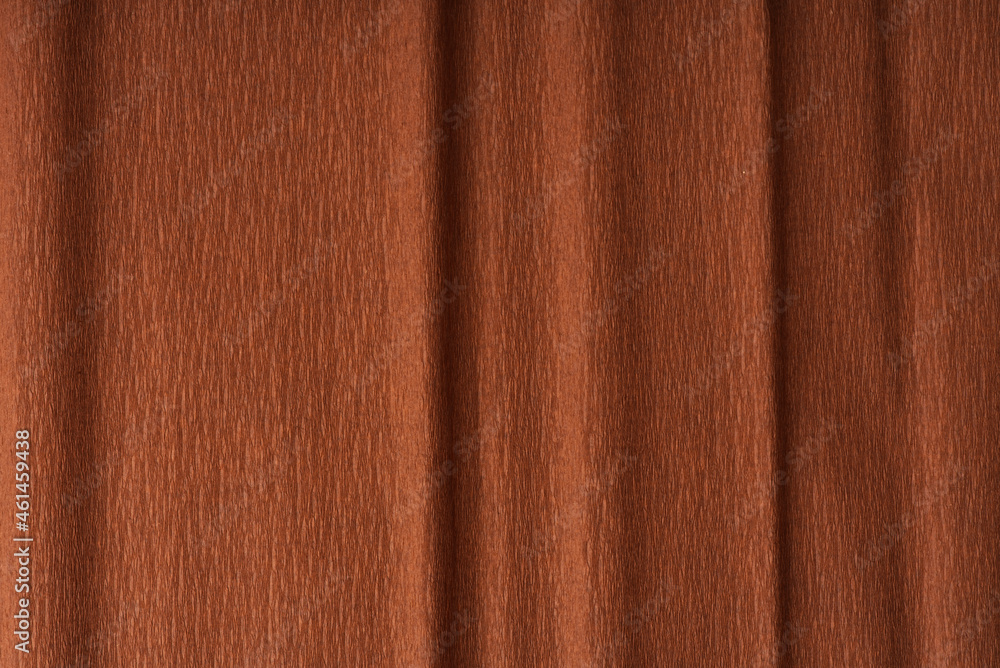 Fototapeta premium Texture of dark brown paper folded in waves a little closer