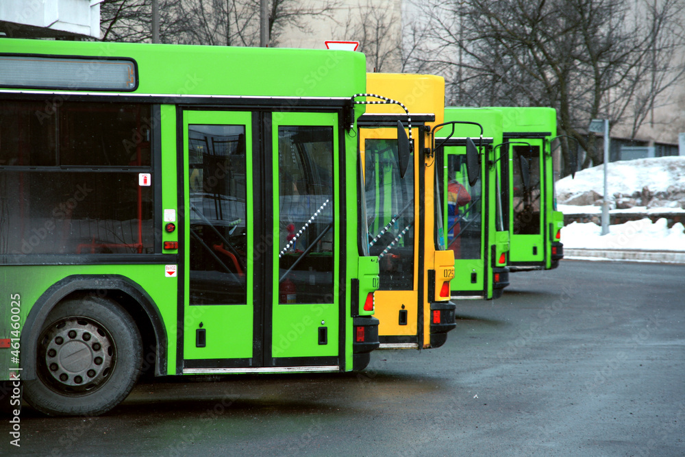 Obraz na płótnie Green and Yellow Buses on the bus station w salonie