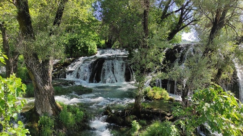 View of a beautiful waterfall in a garden in the south of Bosnia and Herzegovina.