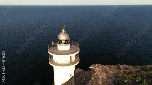 Moscarter lighthouse in Portinatx, a town in the north of the island of Ibiza. Images taken with drone in the winter season. photo